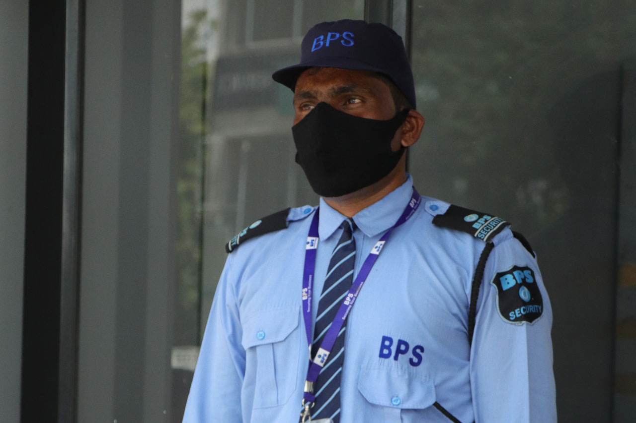 on duty security guard with facemask